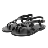 Flate damesandaler med kryssende gullremmer, chic, elegante og komfortable