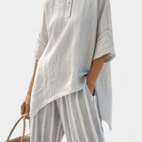 Selma – Elegant asymmetrisk bluse og stripete bukser